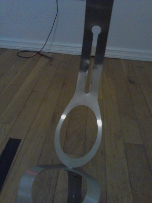 secondary shield pivot point around anus opening in rear strap