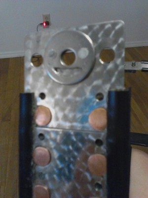 front shield with collar washer with crescent cut out and riveted to front shield