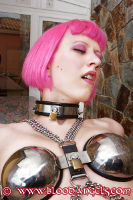 A photo of a girl being locked in a chastitybelt